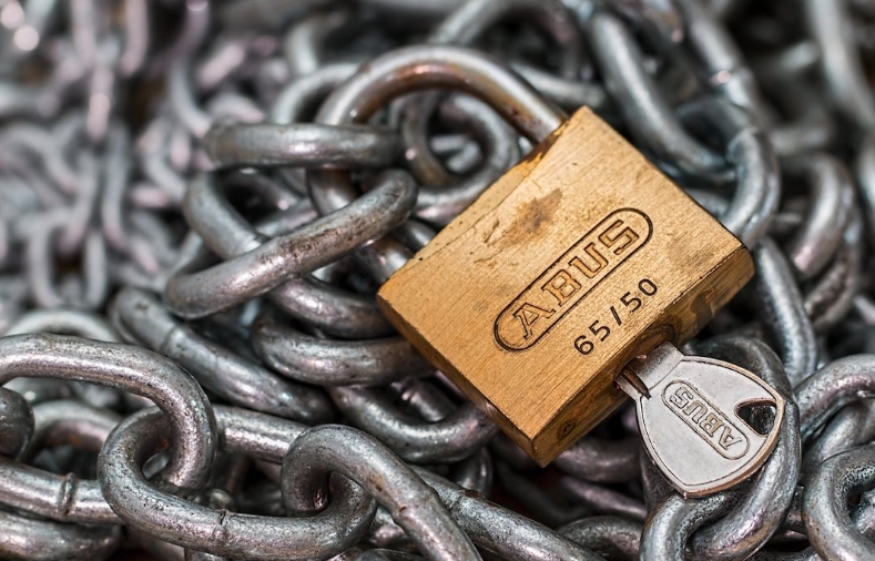 lock on chain to show how mfa for email helps protect your IT systems and accounts. Learn how to implement MFA in your IT security plan.